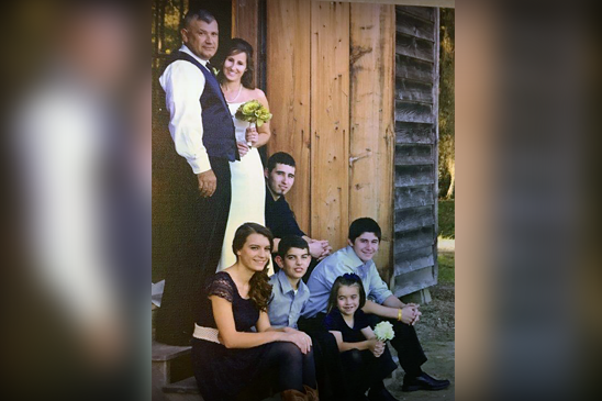 Terry with his wife Christie, and sitting next to them is son Drew, and on the bottom step, are Kensey, Dylan, Samantha and Alex.